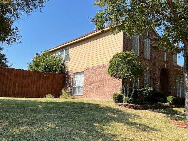 1275 Calistoga Dr, Rockwall, TX 75087 - view of side of home with brick siding