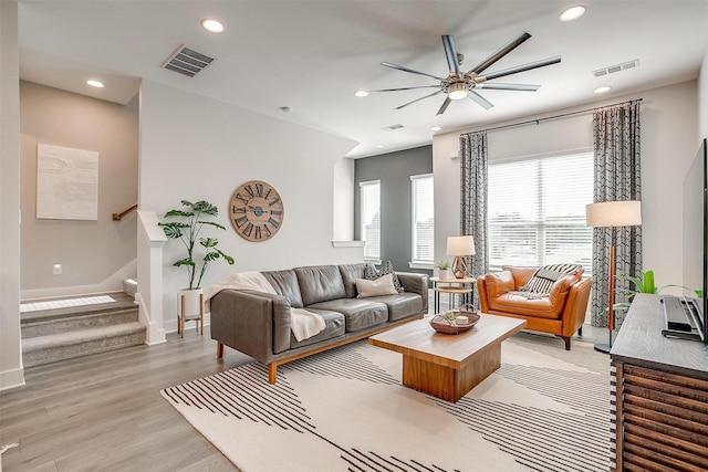 2818 Addison Park Ln, Fort Worth, TX 76110 - living room featuring ceiling fan, recessed lighting, light wood-style flooring, baseboards, and stairs