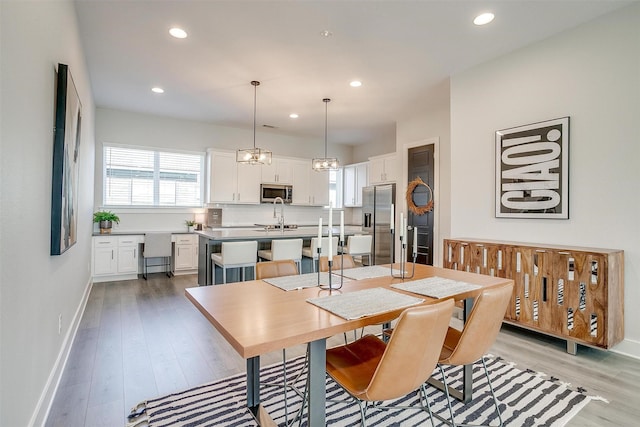 2818 Addison Park Ln, Fort Worth, TX 76110 - dining area featuring recessed lighting, light wood-type flooring, and baseboards