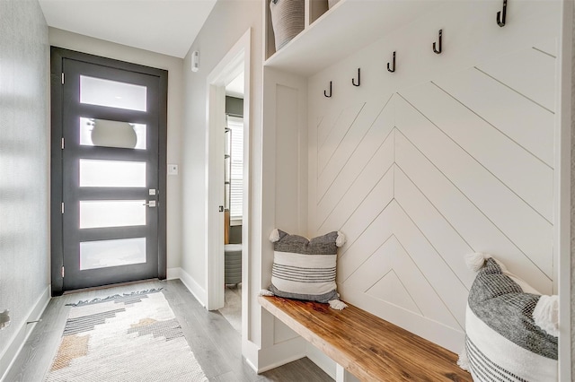 2818 Addison Park Ln, Fort Worth, TX 76110 - mudroom featuring light wood-type flooring and baseboards