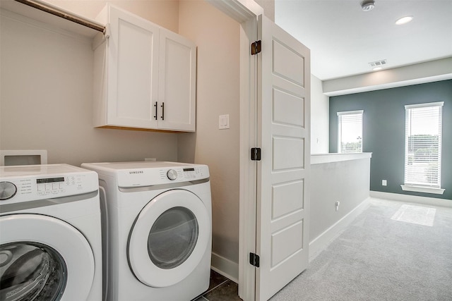 2818 Addison Park Ln, Fort Worth, TX 76110 - laundry room featuring independent washer and dryer, cabinet space, carpet flooring, and baseboards