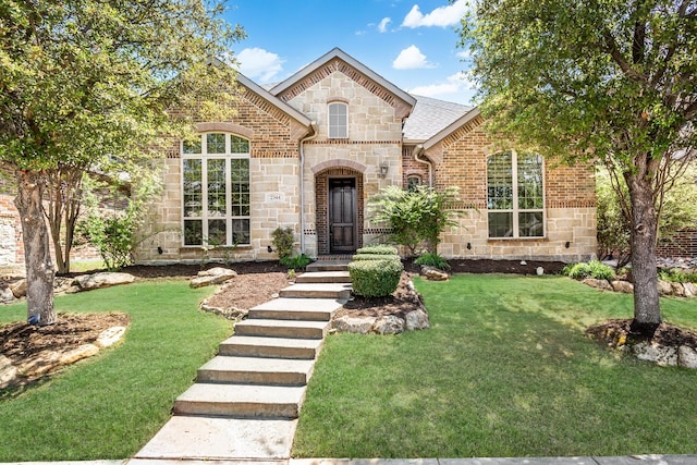 2344 Arezzo Ln, Allen, TX 75013 - french provincial home featuring stone siding, a front lawn, and brick siding