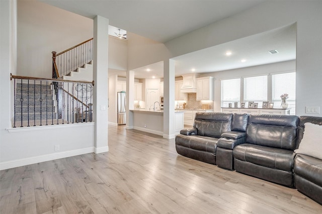 458 Mesquite Grove Rd, Midlothian, TX 76065 - living area with light wood finished floors, stairs, recessed lighting, and baseboards