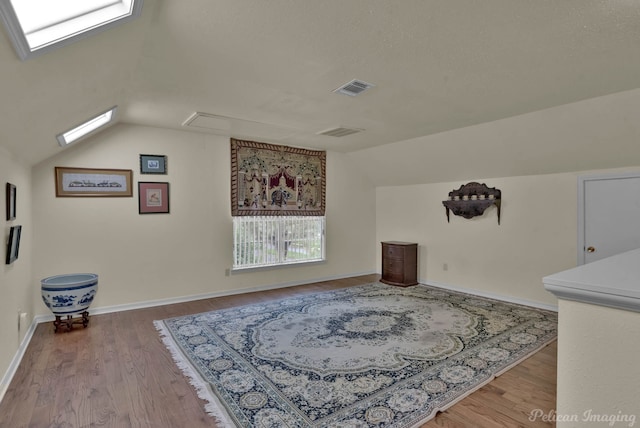 23 Tealwood, Shreveport, LA 71104 - additional living space with lofted ceiling, attic access, wood finished floors, and plenty of natural light