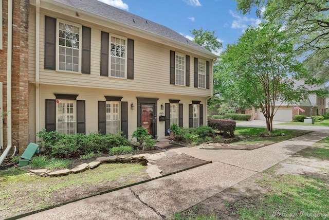 23 Tealwood, Shreveport, LA 71104 - view of front of house with a shingled roof and brick siding