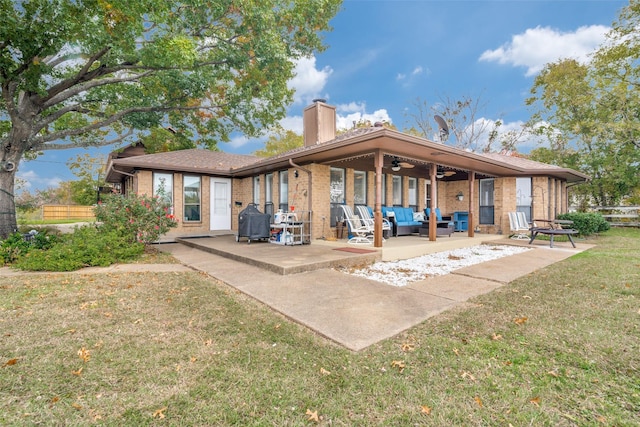 339 W Trinity St, Forney, TX 75126 - back of house with an outdoor living space, a ceiling fan, a patio, a chimney, and brick siding