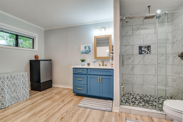 339 W Trinity St, Forney, TX 75126 - full bath with a stall shower, ornamental molding, wood finished floors, toilet, and vanity
