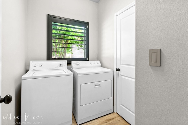 2409 Lynbrook Dr, Abilene, TX 79606 - washroom featuring separate washer and dryer, light wood-type flooring, and a textured wall