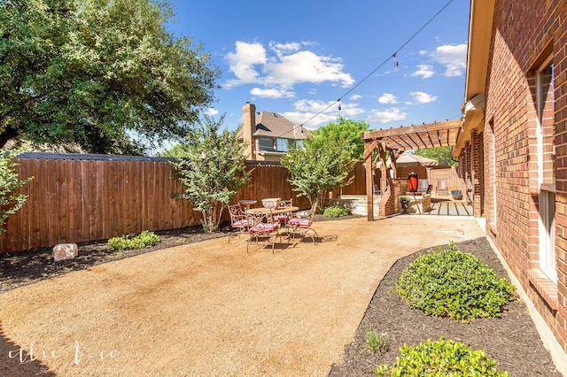 2409 Lynbrook Dr, Abilene, TX 79606 - fenced backyard with a pergola, a patio area, and outdoor dining space