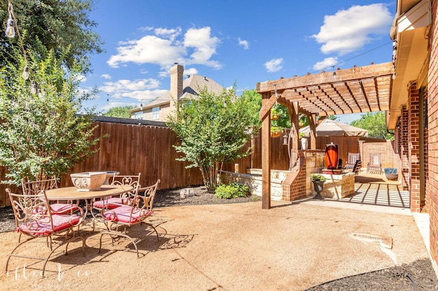 2409 Lynbrook Dr, Abilene, TX 79606 - fenced backyard with a pergola, a patio, and outdoor dining space