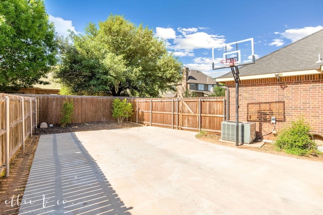 2409 Lynbrook Dr, Abilene, TX 79606 - fenced backyard featuring central AC unit and a patio area