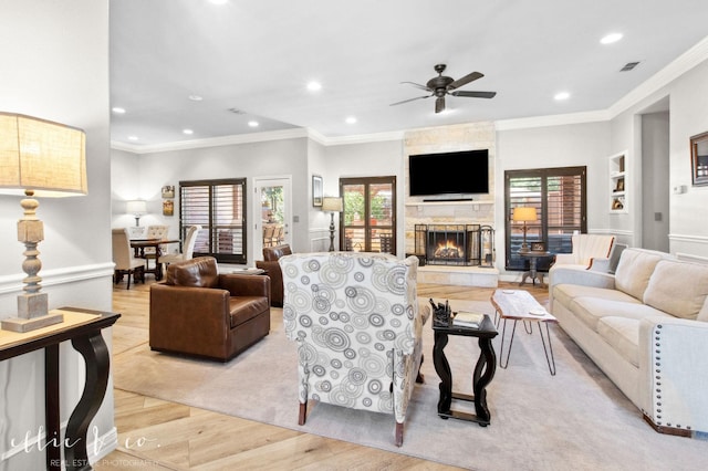 2409 Lynbrook Dr, Abilene, TX 79606 - living area featuring wood finished floors, a ceiling fan, healthy amount of natural light, recessed lighting, and a fireplace