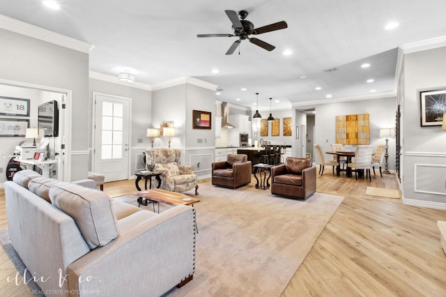 2409 Lynbrook Dr, Abilene, TX 79606 - living room with light wood-style flooring, ornamental molding, ceiling fan, and recessed lighting