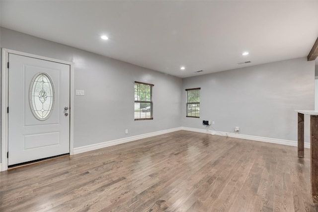 317 Edgefield Dr, Garland, TX 75040 - entryway with recessed lighting, light wood-style flooring, and baseboards