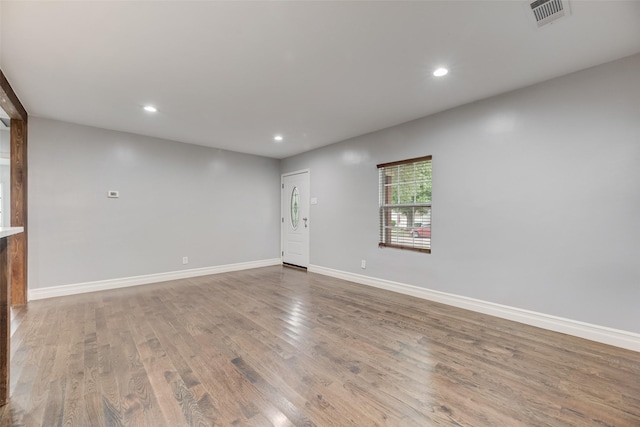 317 Edgefield Dr, Garland, TX 75040 - unfurnished room with wood finished floors, recessed lighting, and baseboards