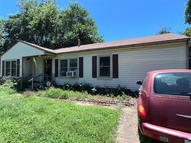 1005 Iowa St, Irving, TX 75060 - ranch-style house with a shingled roof and cooling unit