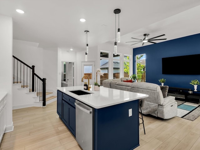 13333 Hedgebrook Pl, Fort Worth, TX 76008 - kitchen with a sink, blue cabinetry, stainless steel dishwasher, light wood-style floors, and recessed lighting