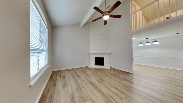 2 Saint Charles Pl, Midlothian, TX 76065 - unfurnished living room featuring a fireplace, ceiling fan, baseboards, and light wood finished floors