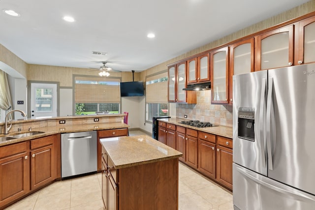 269 Love Bird Ln, Murphy, TX 75094 - kitchen featuring stainless steel appliances, a sink, a ceiling fan, under cabinet range hood, and a center island
