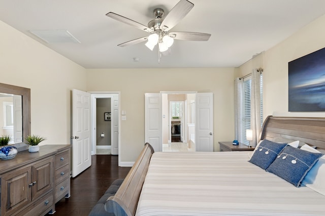 269 Love Bird Ln, Murphy, TX 75094 - bedroom with dark wood-style floors, baseboards, and a ceiling fan