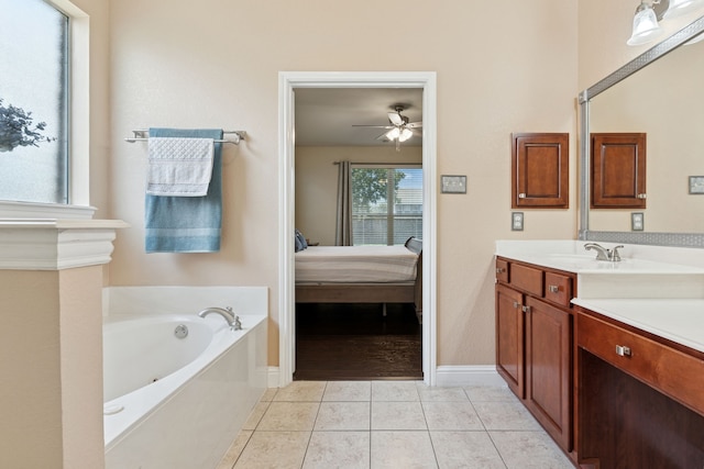 269 Love Bird Ln, Murphy, TX 75094 - ensuite bathroom featuring a tub with jets, vanity, a ceiling fan, tile patterned floors, and baseboards