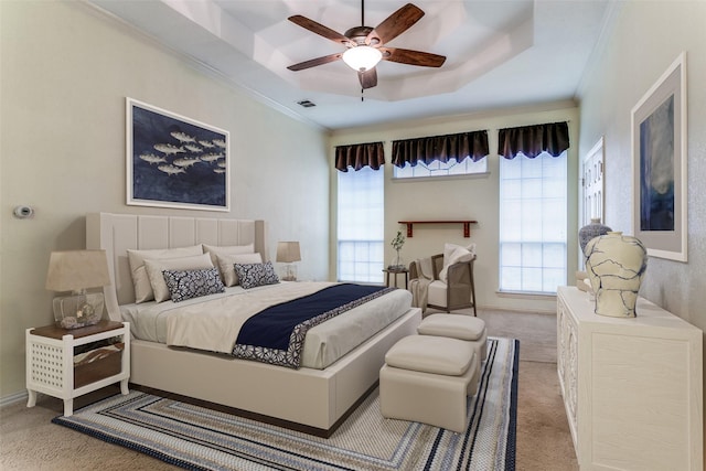 126 Oakbend Dr, Coppell, TX 75019 - bedroom with light colored carpet, ornamental molding, multiple windows, a raised ceiling, and ceiling fan