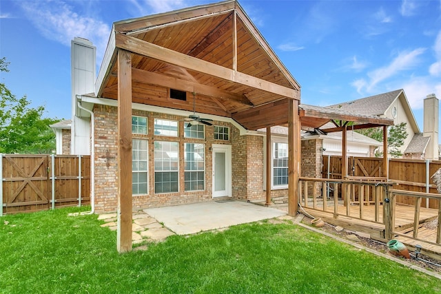 126 Oakbend Dr, Coppell, TX 75019 - back of house featuring a chimney, a ceiling fan, a deck, brick siding, and a patio