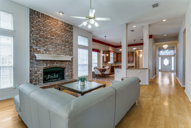126 Oakbend Dr, Coppell, TX 75019 - living area featuring baseboards, ceiling fan, healthy amount of natural light, and light wood-style floors