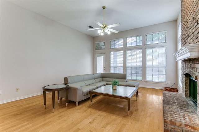 126 Oakbend Dr, Coppell, TX 75019 - living room with a fireplace, plenty of natural light, and a ceiling fan