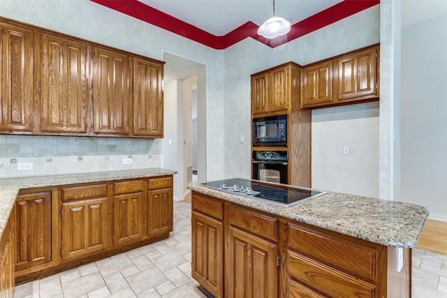 126 Oakbend Dr, Coppell, TX 75019 - kitchen with black appliances, brown cabinetry, decorative backsplash, and light stone countertops