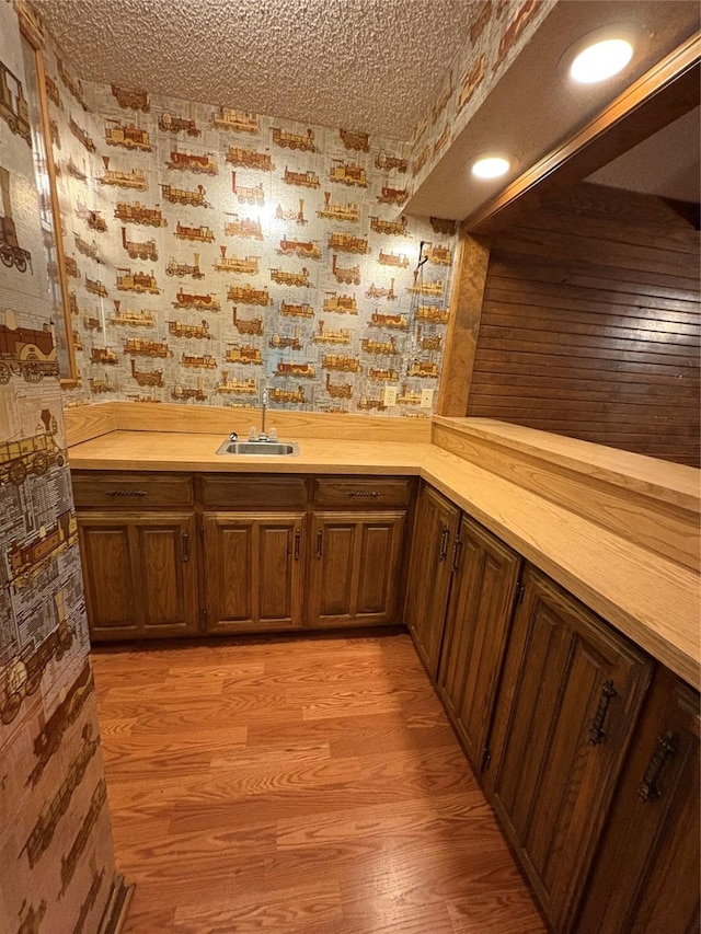 327 Shadowwood Trl, Ovilla, TX 75154 - indoor wet bar featuring wallpapered walls and light wood finished floors