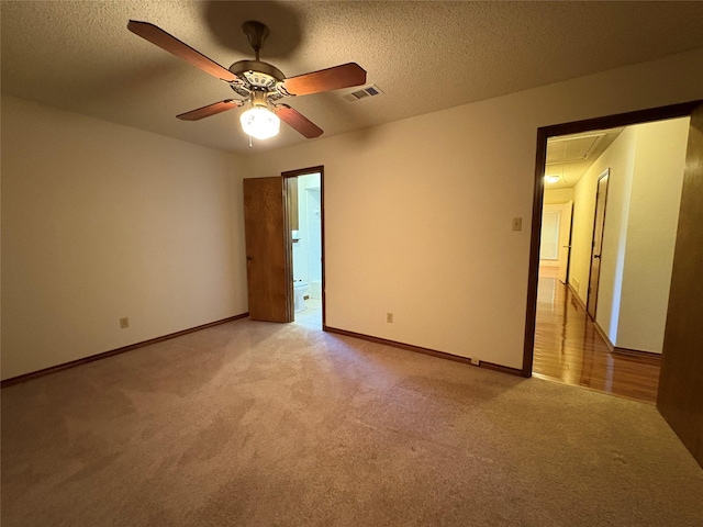 327 Shadowwood Trl, Ovilla, TX 75154 - unfurnished room featuring attic access, light carpet, ceiling fan, baseboards, and a textured ceiling