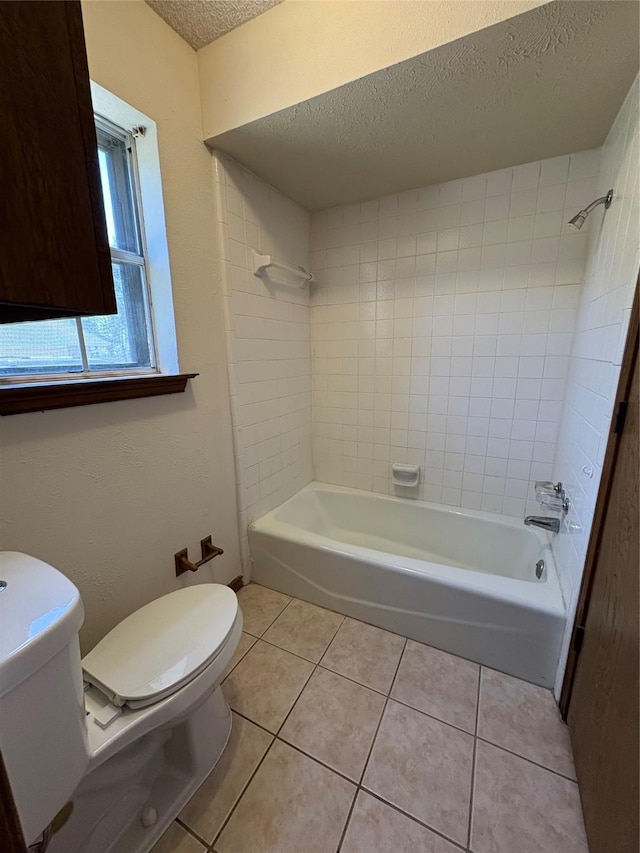 327 Shadowwood Trl, Ovilla, TX 75154 - full bathroom featuring toilet, a textured ceiling, tile patterned floors, and shower / bathtub combination