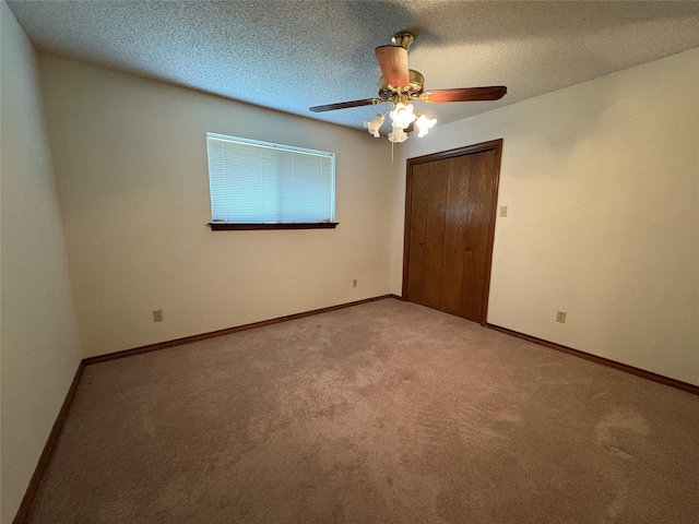 327 Shadowwood Trl, Ovilla, TX 75154 - unfurnished bedroom featuring carpet, a closet, ceiling fan, baseboards, and a textured ceiling