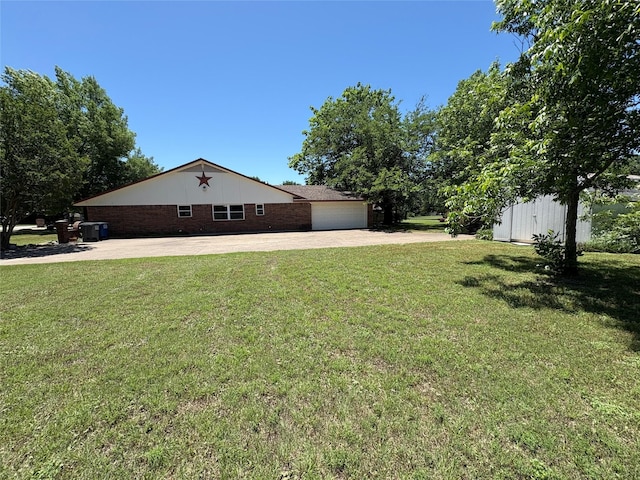 327 Shadowwood Trl, Ovilla, TX 75154 - view of green lawn with concrete driveway and a garage