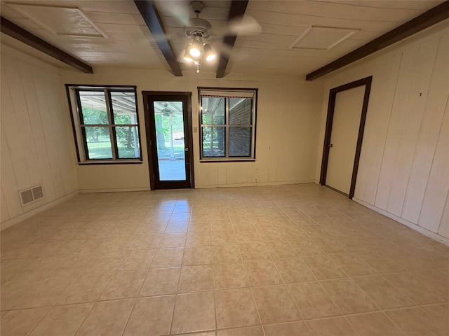 327 Shadowwood Trl, Ovilla, TX 75154 - empty room featuring a ceiling fan, light tile patterned floors, and beamed ceiling