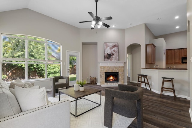 2608 Dunbar Dr, Mckinney, TX 75072 - living room featuring wood finished floors, ceiling fan, a stone fireplace, lofted ceiling, and recessed lighting
