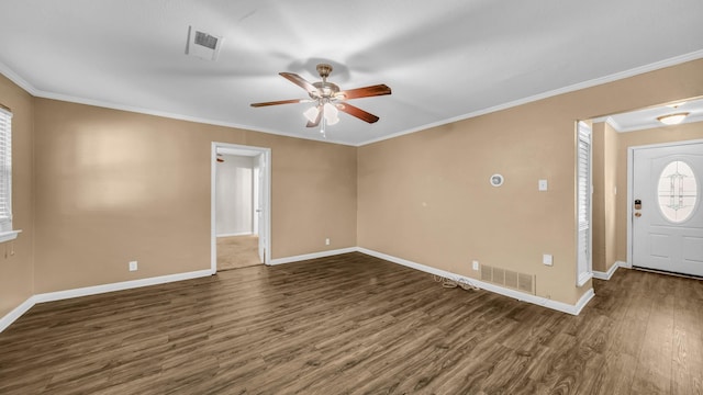 7521 S College Cir, North Richland Hills, TX 76180 - foyer entrance featuring dark wood finished floors, baseboards, ceiling fan, and ornamental molding