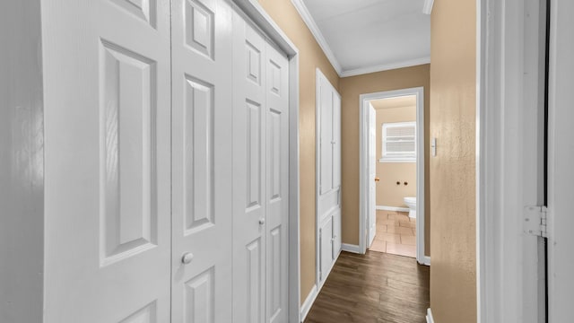 7521 S College Cir, North Richland Hills, TX 76180 - hallway with ornamental molding, baseboards, and dark wood-type flooring