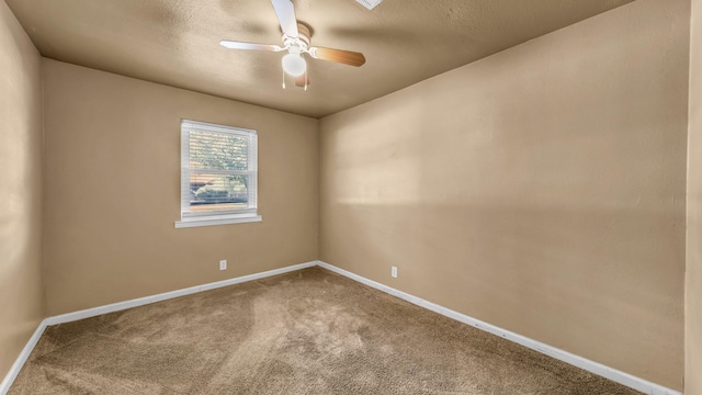 7521 S College Cir, North Richland Hills, TX 76180 - carpeted spare room with ceiling fan, baseboards, and a textured ceiling