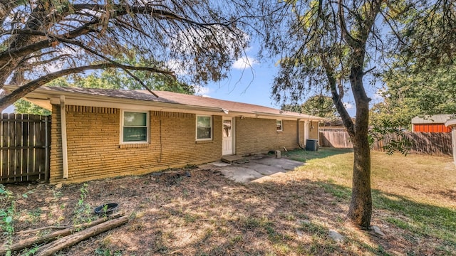 7521 S College Cir, North Richland Hills, TX 76180 - back of house with brick siding and central AC
