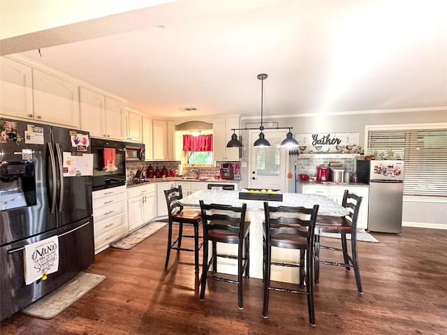812 Walters St, Frankston, TX 75763 - kitchen featuring black appliances, a sink, white cabinetry, dark wood-style floors, and tasteful backsplash