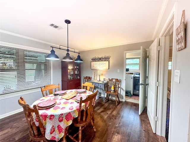 812 Walters St, Frankston, TX 75763 - dining space with crown molding, dark wood-style flooring, washer and dryer, and baseboards