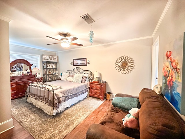 812 Walters St, Frankston, TX 75763 - bedroom featuring wood finished floors, ornamental molding, and ceiling fan