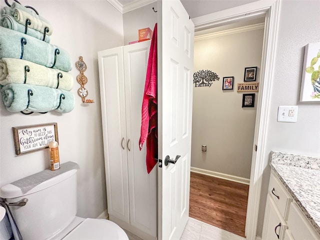 812 Walters St, Frankston, TX 75763 - half bath featuring ornamental molding, toilet, vanity, and baseboards