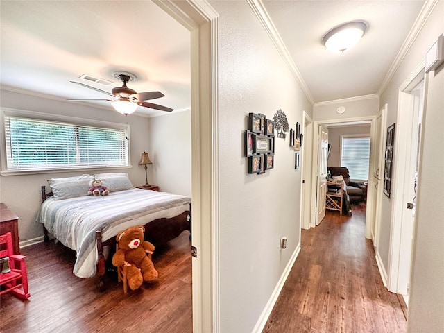 812 Walters St, Frankston, TX 75763 - bedroom with wood finished floors, ornamental molding, and baseboards