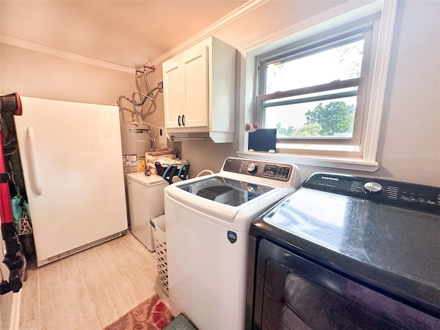 812 Walters St, Frankston, TX 75763 - laundry room with independent washer and dryer, cabinet space, electric water heater, crown molding, and light wood-type flooring