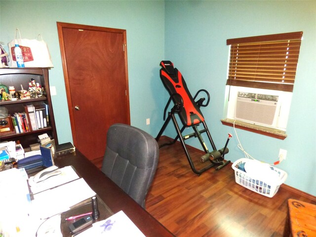 1075 County Road 436, Eastland, TX 76448 - office space featuring wood finished floors, cooling unit, and baseboards