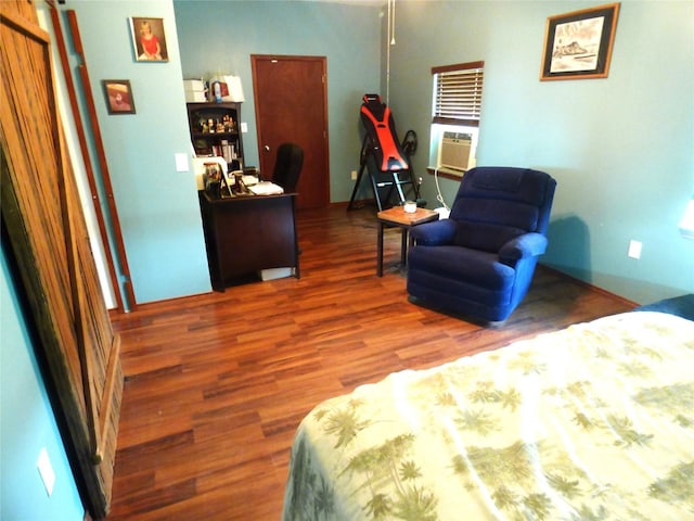 1075 County Road 436, Eastland, TX 76448 - bedroom featuring wood finished floors and cooling unit