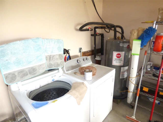 1075 County Road 436, Eastland, TX 76448 - washroom with washer and dryer and electric water heater